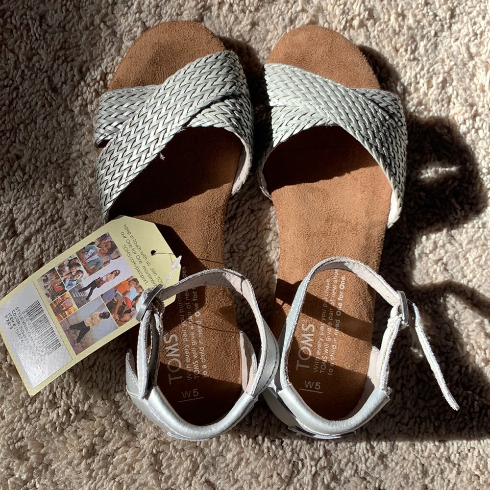Toms silver sandals. Brand new w tag still attached